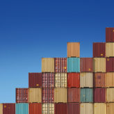 Cargo containers ascending chart on blue sky background. See my other similar photos: :  http://www.oc-photo.net/FTP/icons/cargo.jpg